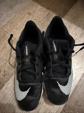 Nike Black Cleats with White Striped Swoosh